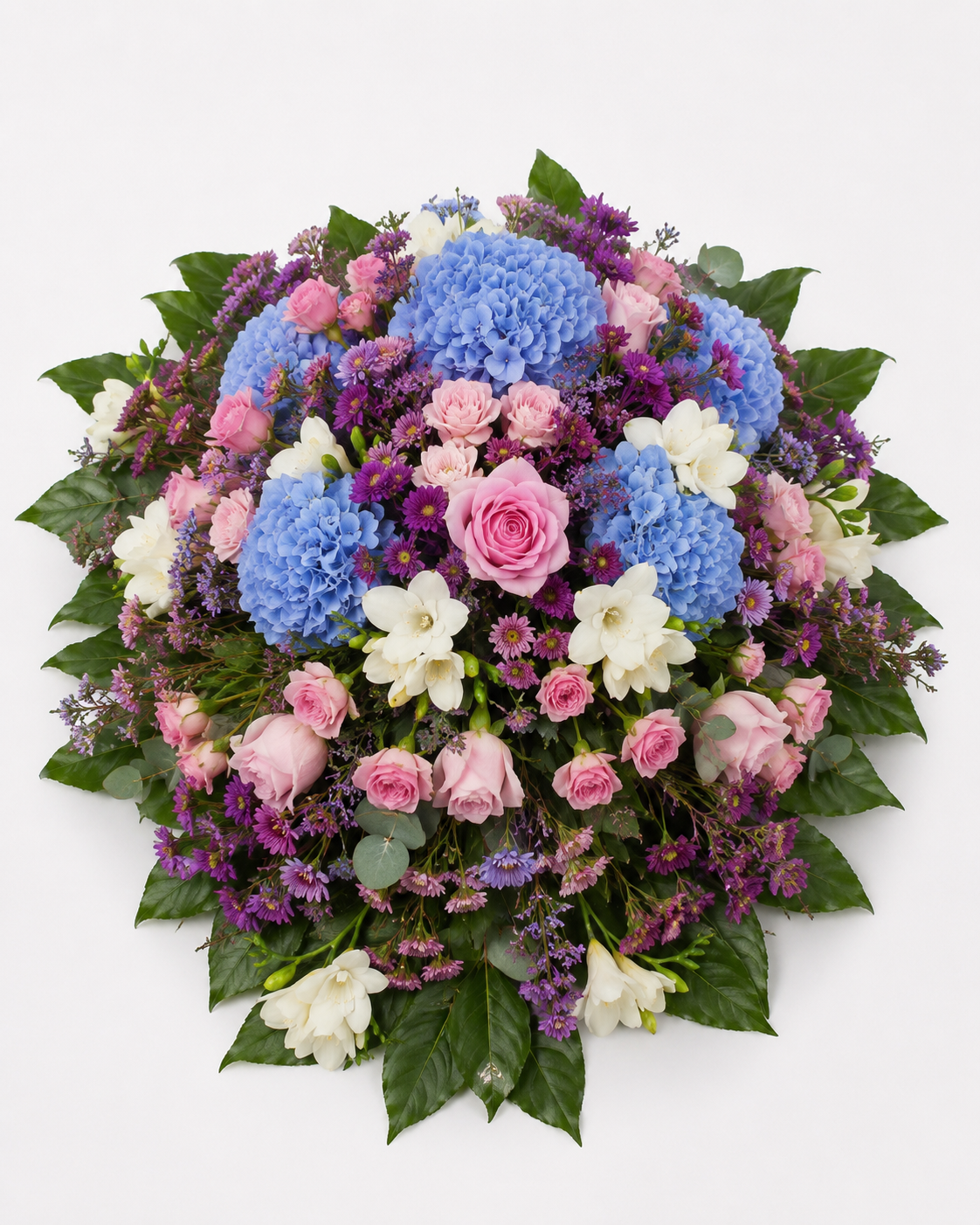 Blomsteropsats i blå, rosa og lilla nuancer