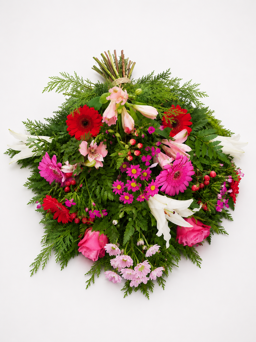 Bårebuket med pink, rød og hvide blomster