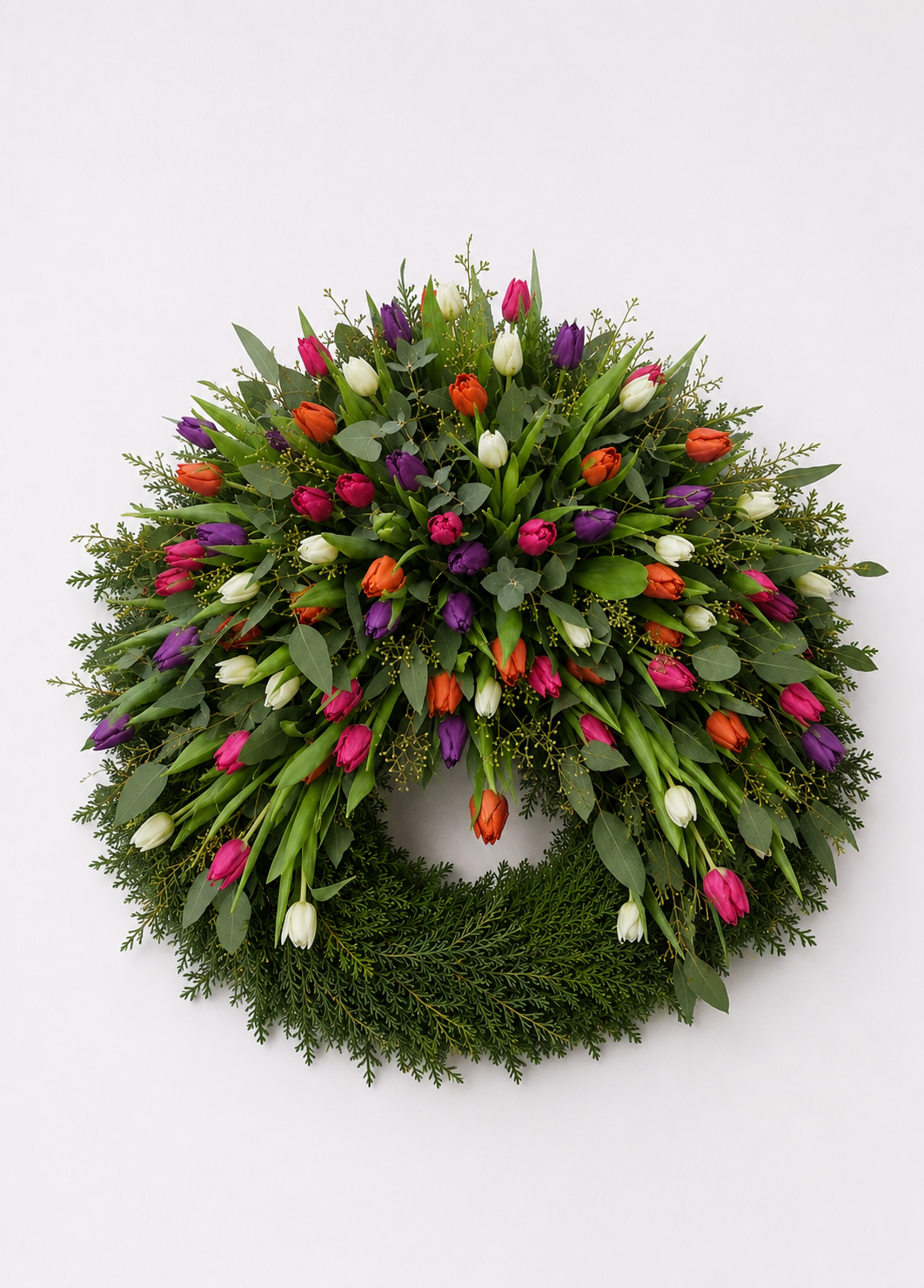 Begravelseskrans med farvede tulipaner