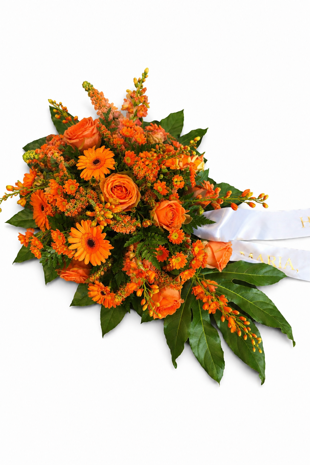 Blomsteropsats i varme orange og gule nuancer
